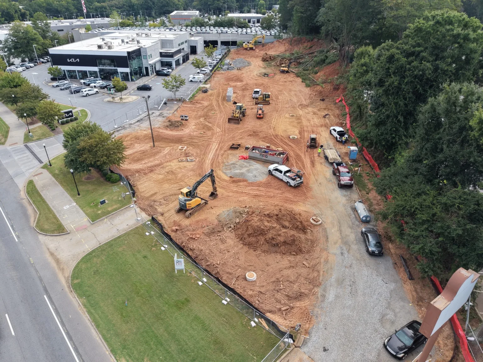 Overhead view of site preparation beside a commercial building
